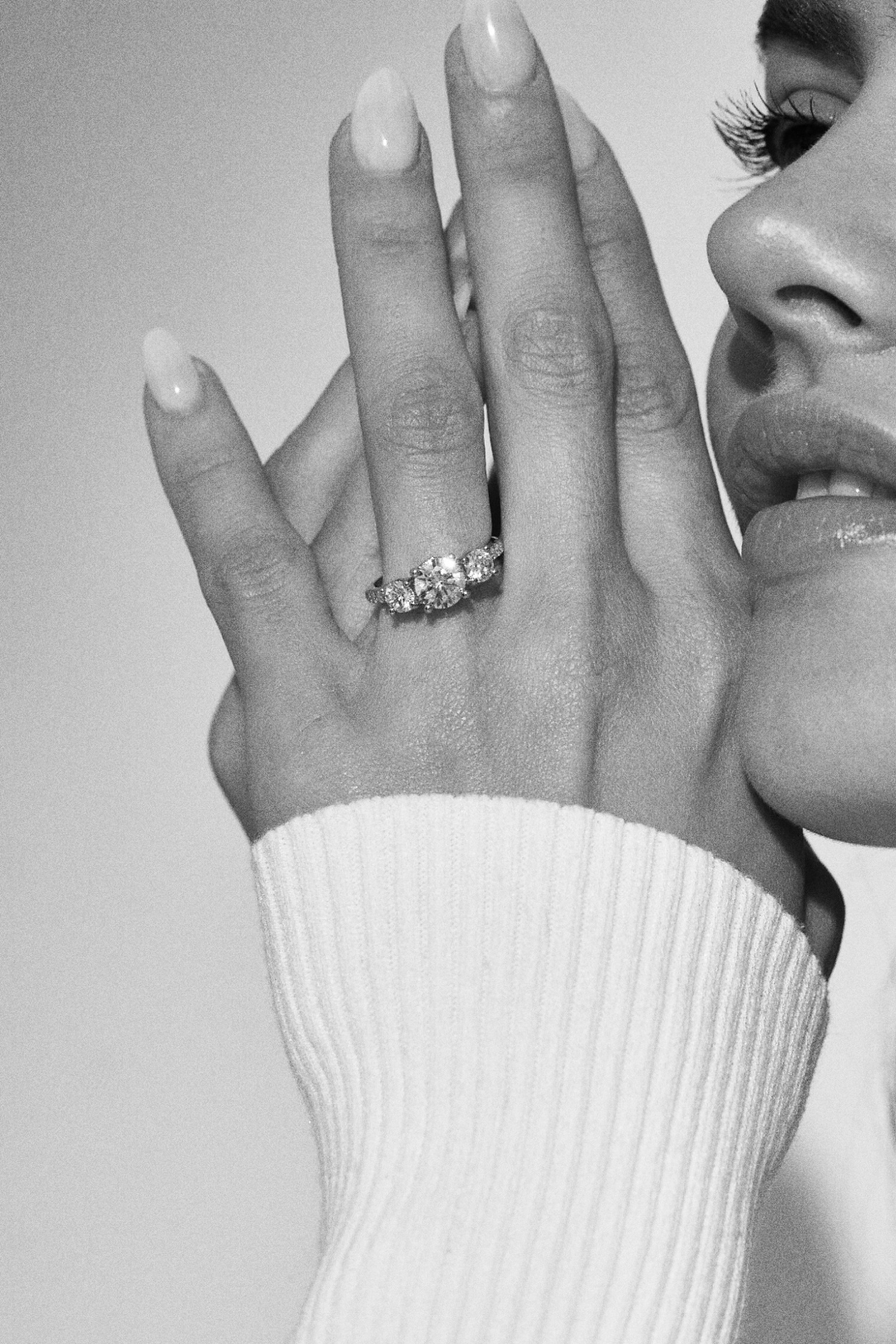 Round diamond trilogy engagement ring 